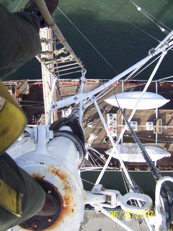 Looking down on the deck of a tall ship from high in the rigging